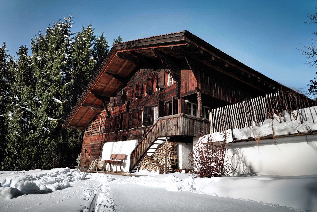 Chalet Amalia in winter, traditional Bauernhaus covered in fresh Alpine snow